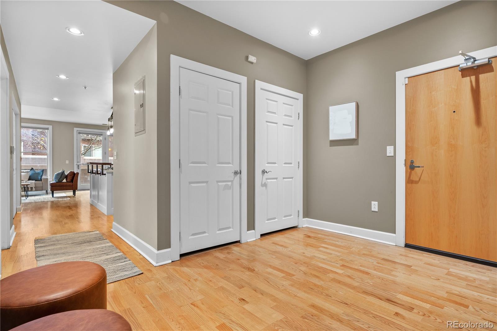1630 North Clarkson Street, Unit 110 Denver, CO 80218 - Photo 5 of 36 a view of livingroom with furniture and wooden floor