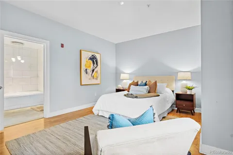 a bedroom with two beds and painted walls