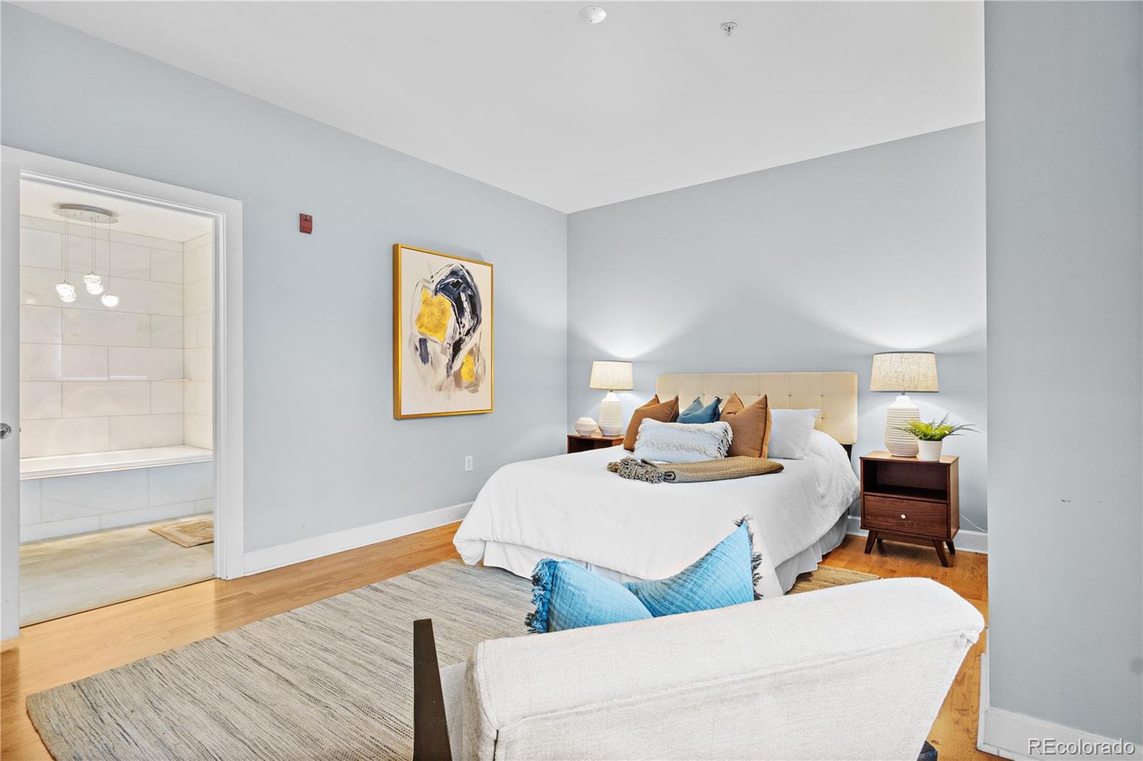 1630 North Clarkson Street, Unit 110 Denver, CO 80218 - Photo 7 of 36 a bedroom with two beds and painted walls