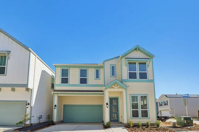 a front view of a house with parking