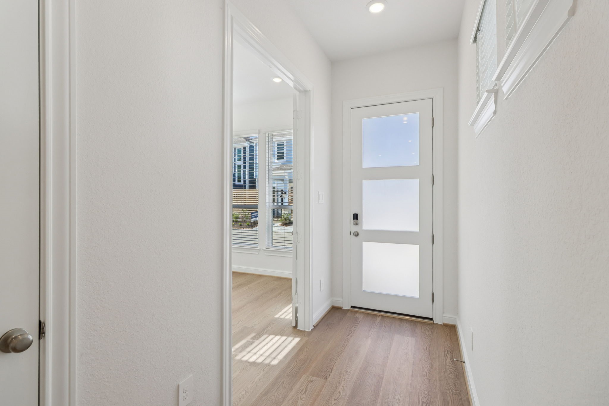 708 Topwater Trail Kemah, TX 77565 - Photo 11 of 43 an empty room with wooden floor and windows
