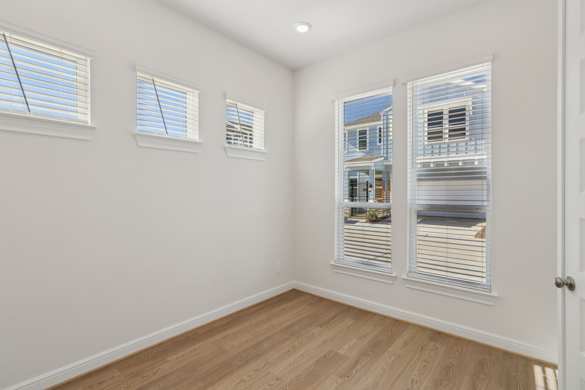 708 Topwater Trail Kemah, TX 77565 - Photo 12 of 43 a view of an empty room with wooden floor and a window