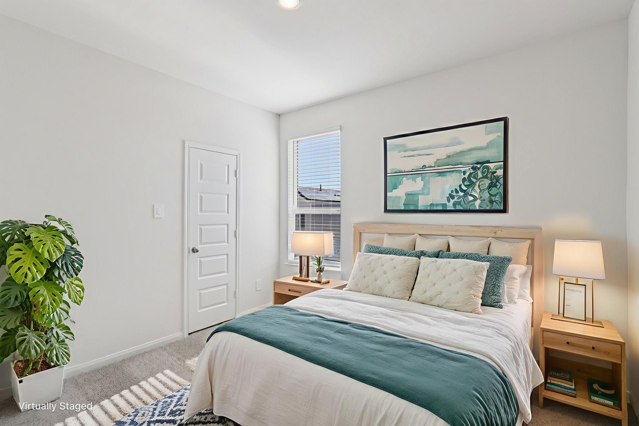 708 Topwater Trail Kemah, TX 77565 - Photo 26 of 43 a bedroom with a bed and a potted plant