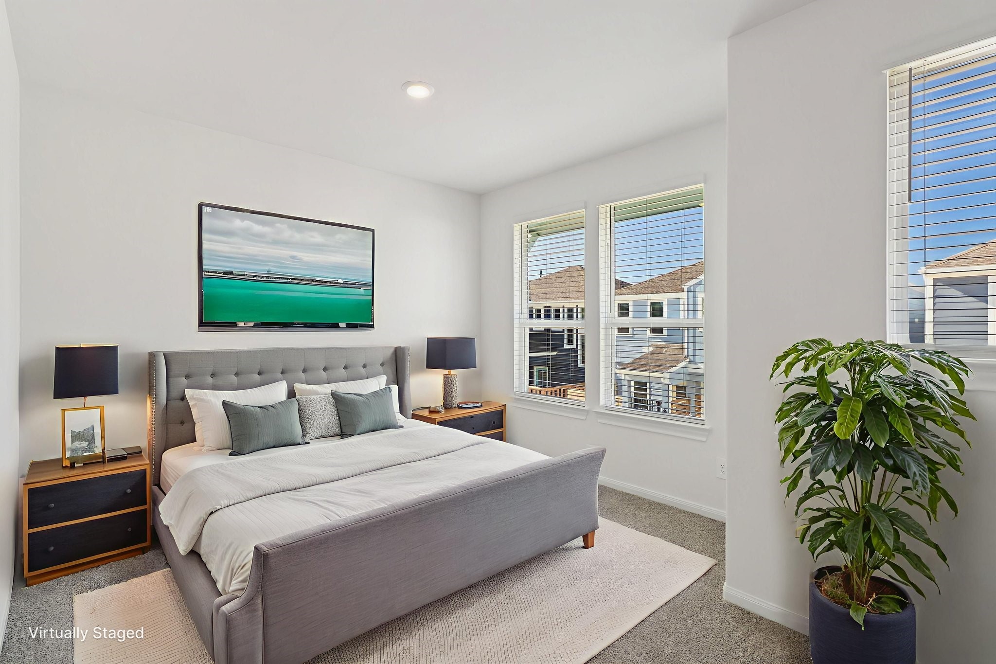 708 Topwater Trail Kemah, TX 77565 - Photo 34 of 43 a bedroom with a large bed and a potted plant