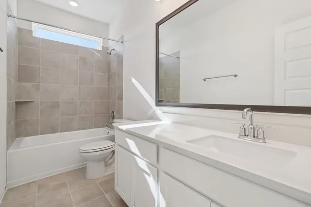 a bathroom with a sink a toilet and a bathtub