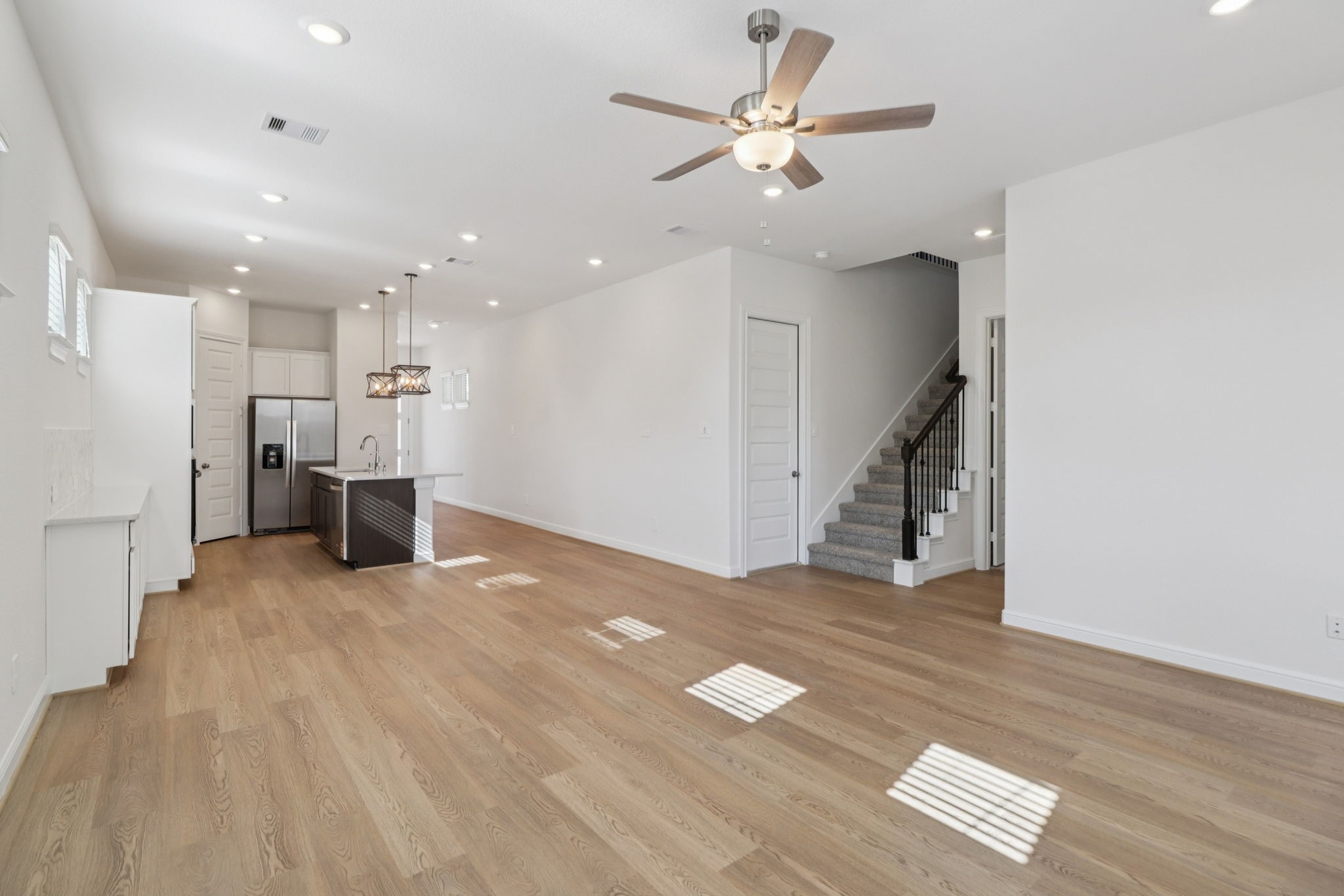 708 Topwater Trail Kemah, TX 77565 - Photo 4 of 43 a view of a livingroom with wooden floor and staircase