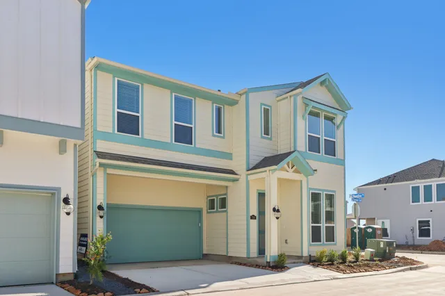 a front view of a house with a garage