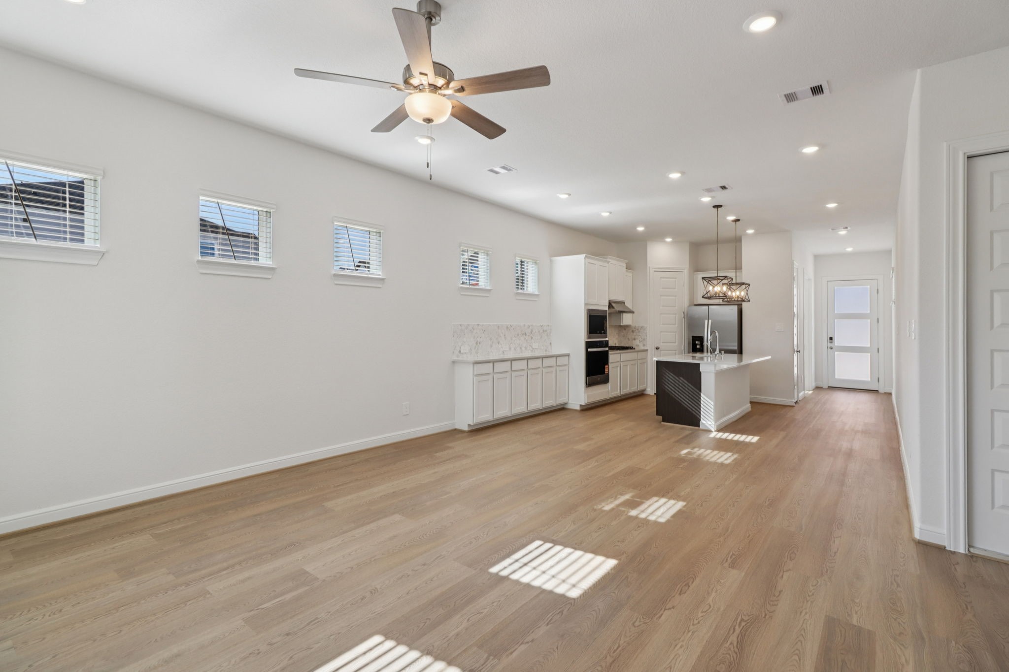 708 Topwater Trail Kemah, TX 77565 - Photo 5 of 43 a view of kitchen with refrigerator stove and wooden floor