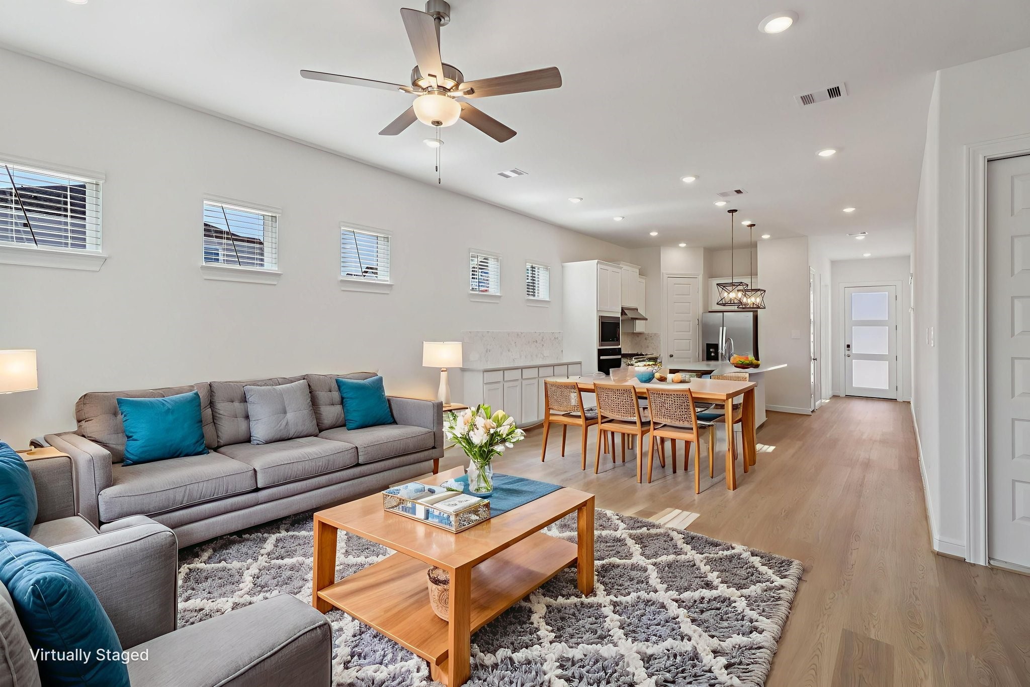 708 Topwater Trail Kemah, TX 77565 - Photo 6 of 43 a living room with furniture kitchen view and a dining table