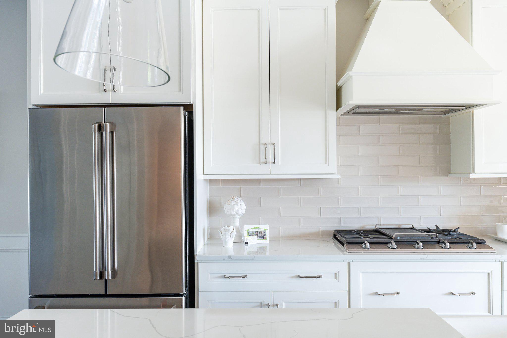 206 North Aberdeen Avenue, Unit D Wayne, PA 19087 - Photo 8 of 36 Sleek modern kitchen with elegance.
