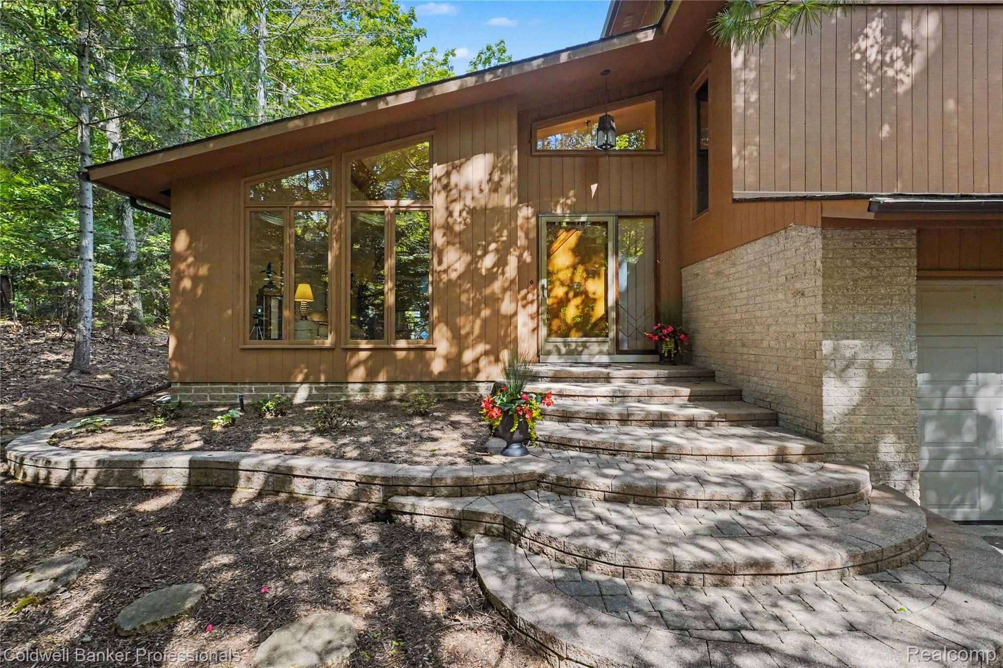 3583 Mitchell Road Metamora, MI 48455 - Photo 5 of 58 Contemporary exterior featuring wood siding and stone veneer
