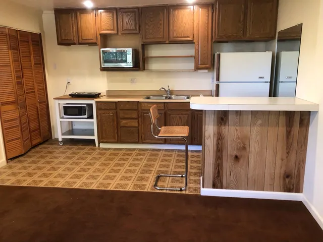 a kitchen with stainless steel appliances a stove and a refrigerator