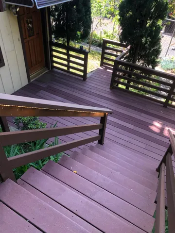 a view of a wooden bench in a yard