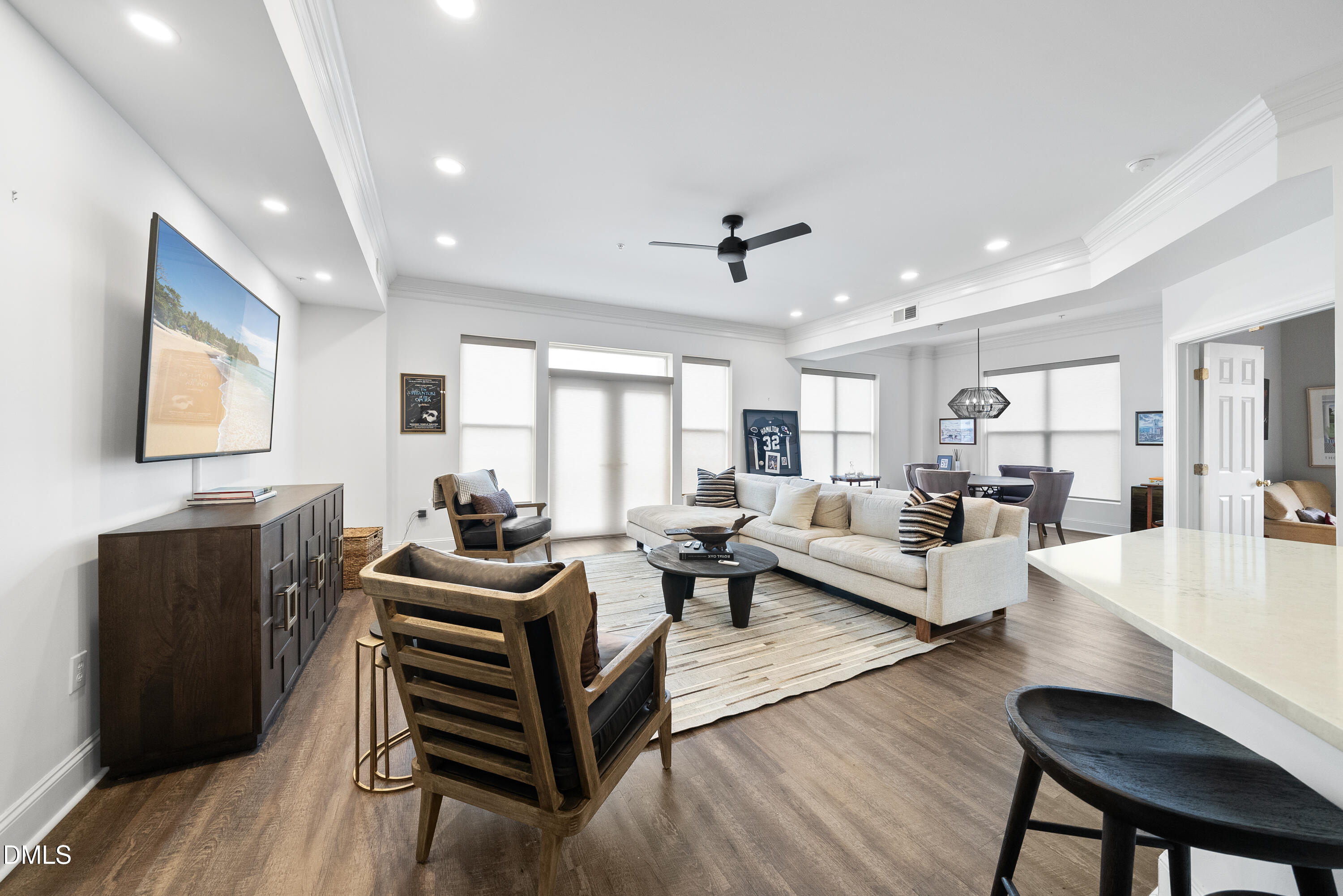 200 South Dawson Street, Unit 306 Raleigh, NC 27601 - Photo 9 of 24 a living room with furniture and wooden floor