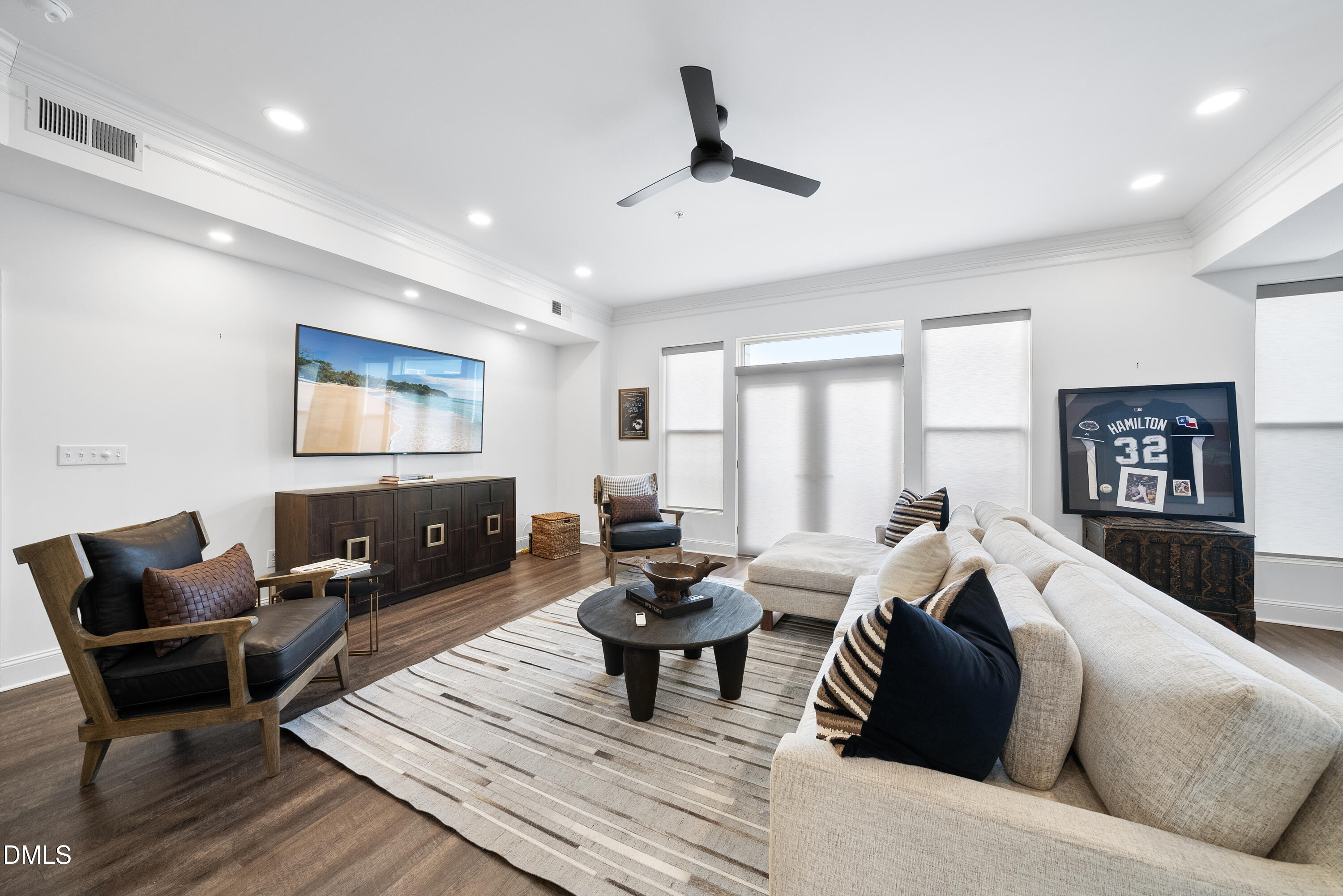 200 South Dawson Street, Unit 306 Raleigh, NC 27601 - Photo 10 of 24 a living room with furniture and a flat screen tv