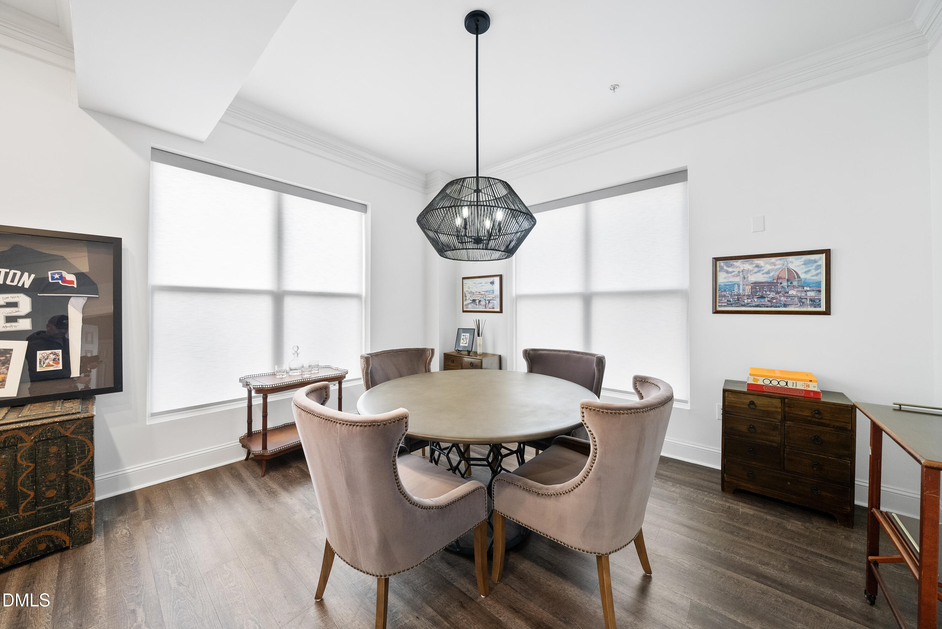 200 South Dawson Street, Unit 306 Raleigh, NC 27601 - Photo 12 of 24 a dining room with furniture a window and wooden floor