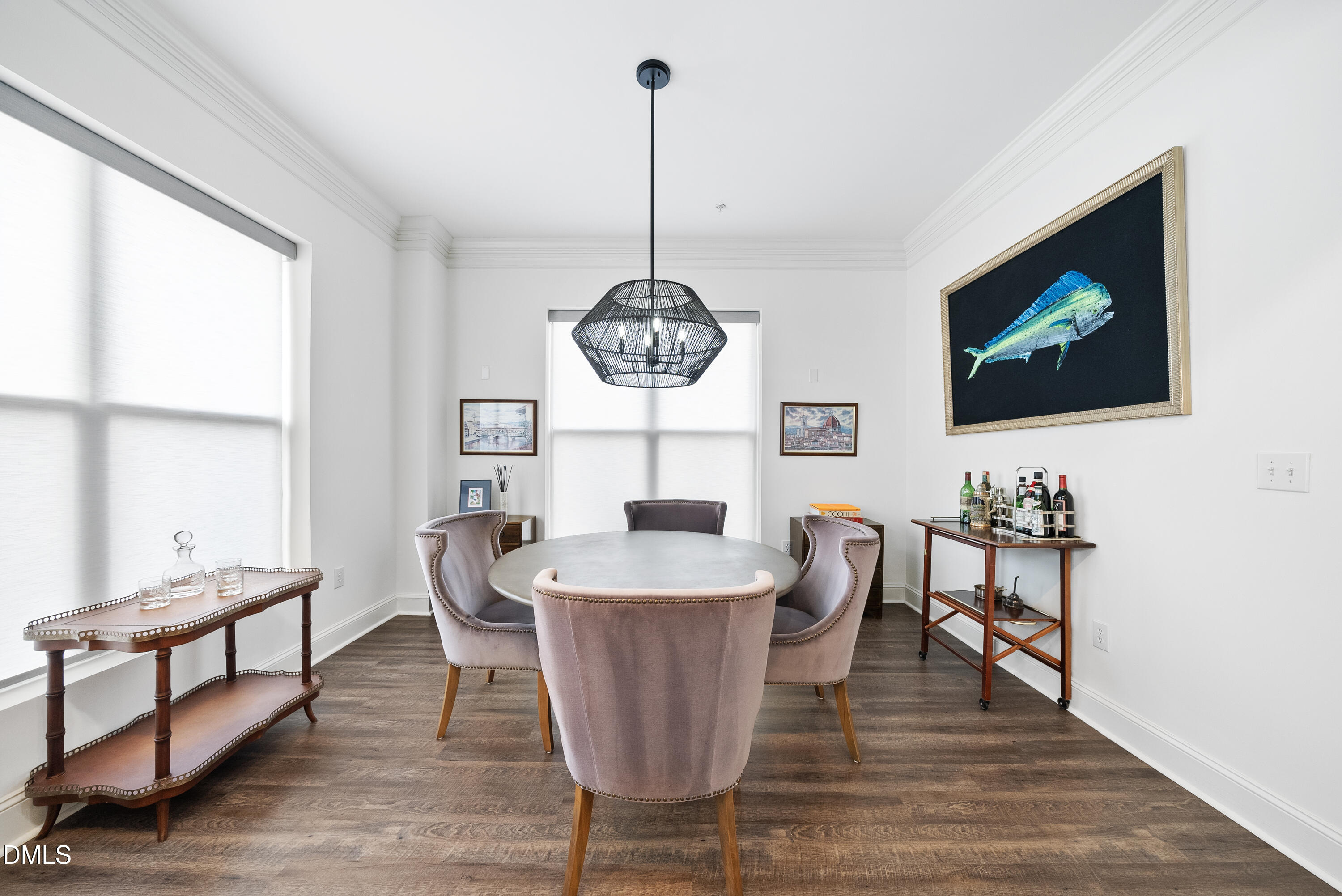 200 South Dawson Street, Unit 306 Raleigh, NC 27601 - Photo 13 of 24 a dining room with furniture a chandelier and wooden floor