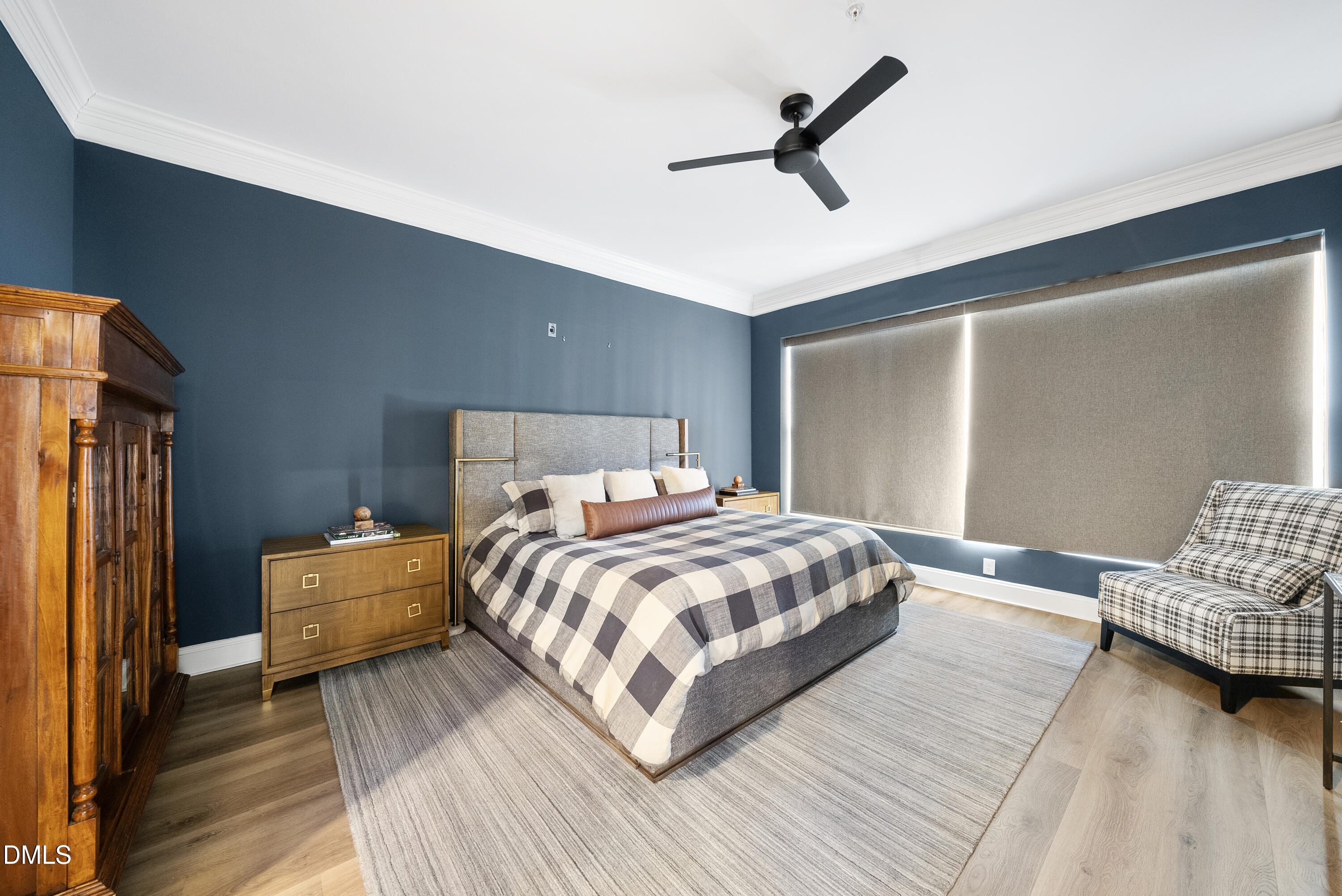 200 South Dawson Street, Unit 306 Raleigh, NC 27601 - Photo 14 of 24 a bedroom with a bed and wooden floor