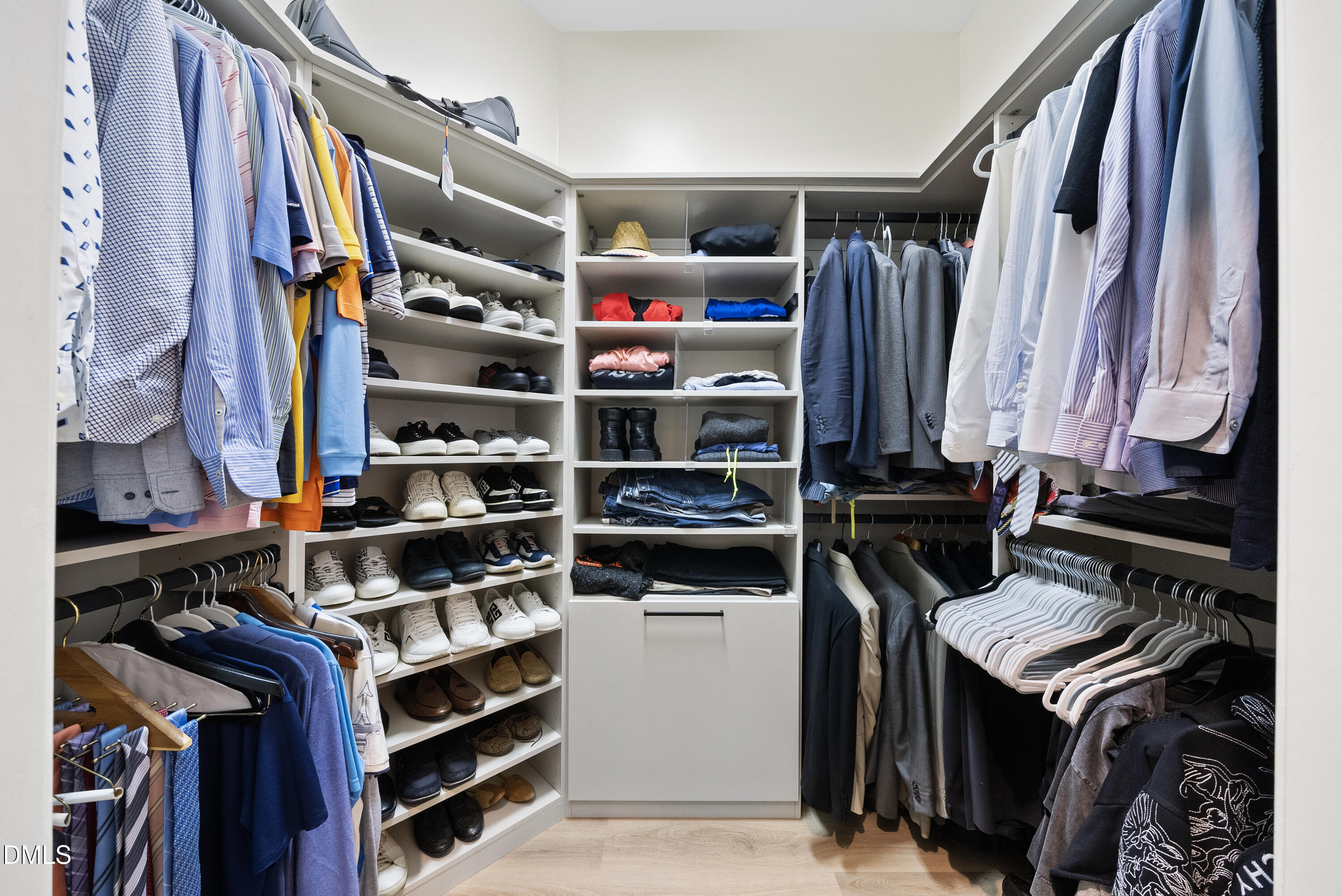 200 South Dawson Street, Unit 306 Raleigh, NC 27601 - Photo 16 of 24 a view of walk in closet with clothes and shoes