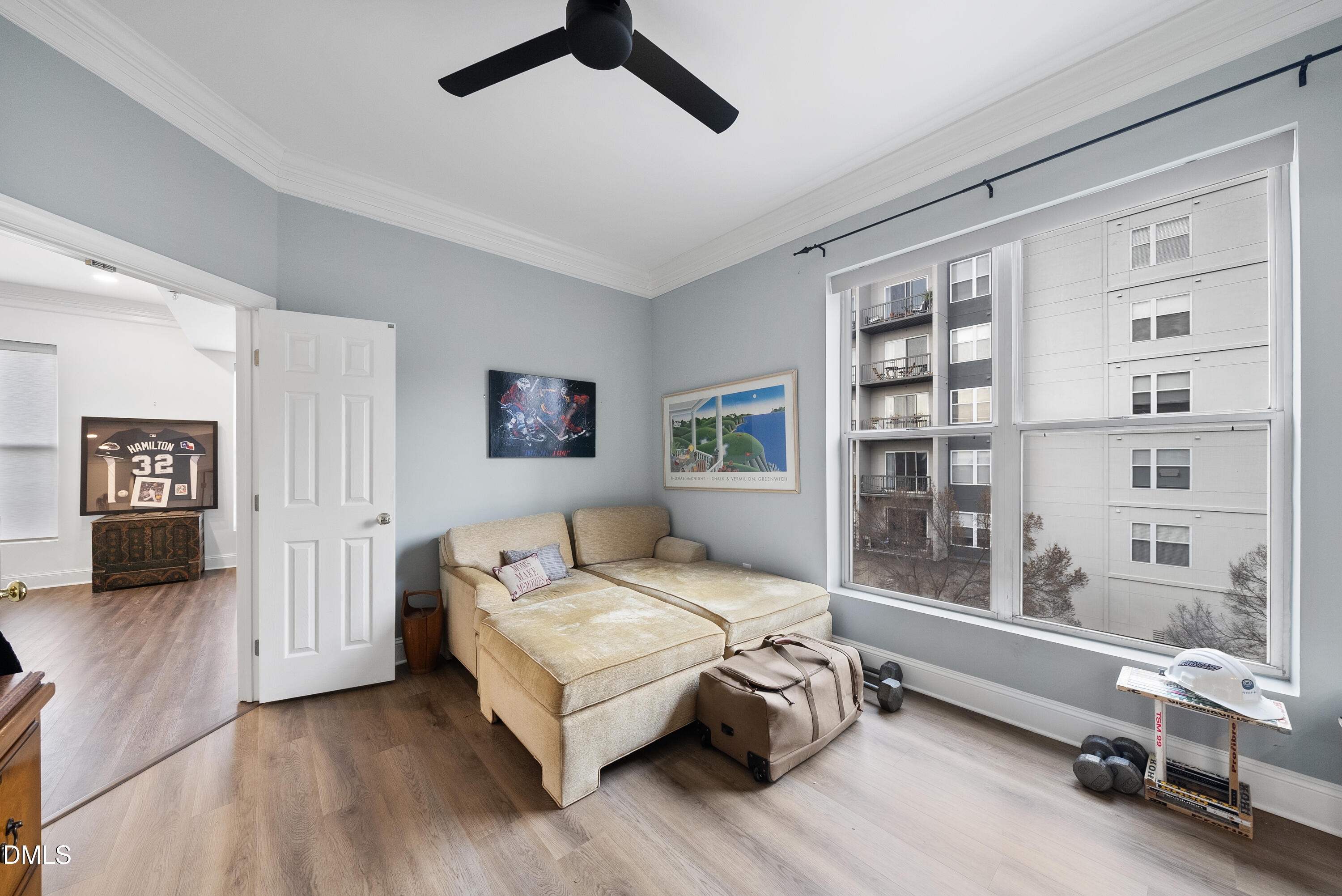 200 South Dawson Street, Unit 306 Raleigh, NC 27601 - Photo 20 of 24 a living room with a bed furniture and a window