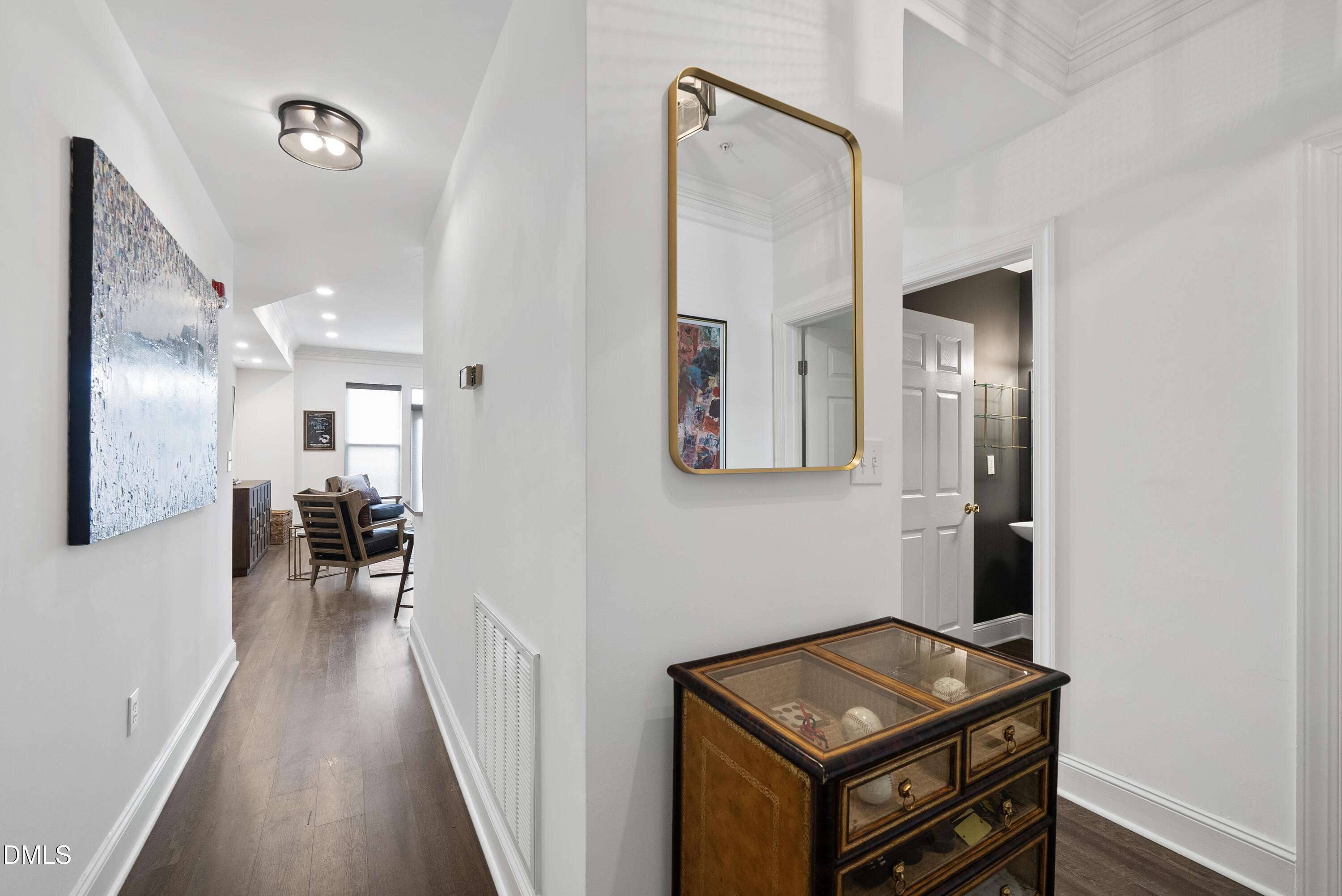 200 South Dawson Street, Unit 306 Raleigh, NC 27601 - Photo 4 of 24 a view of a hallway with workspace and a mirror