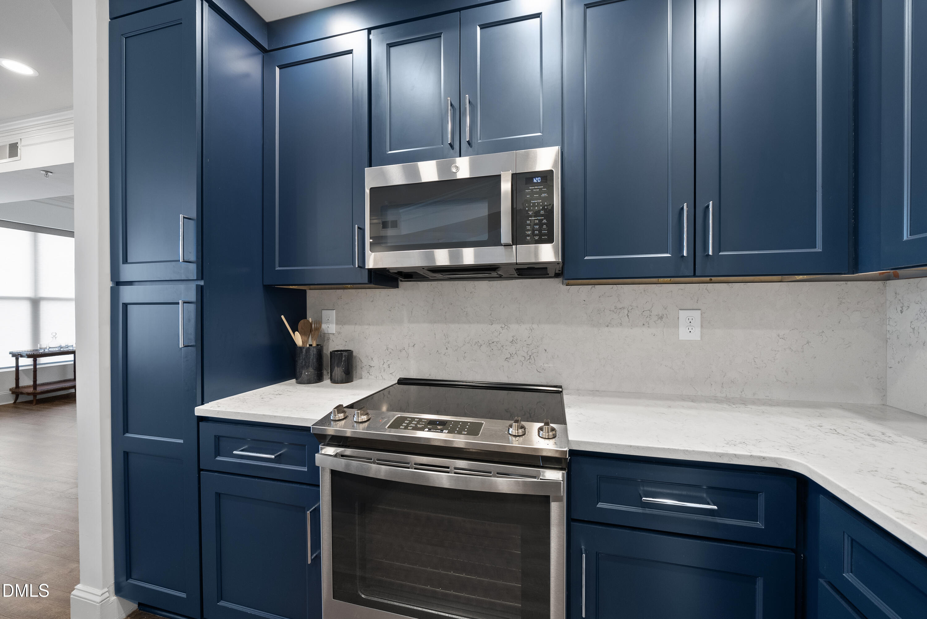 200 South Dawson Street, Unit 306 Raleigh, NC 27601 - Photo 6 of 24 a kitchen with a stove and a microwave