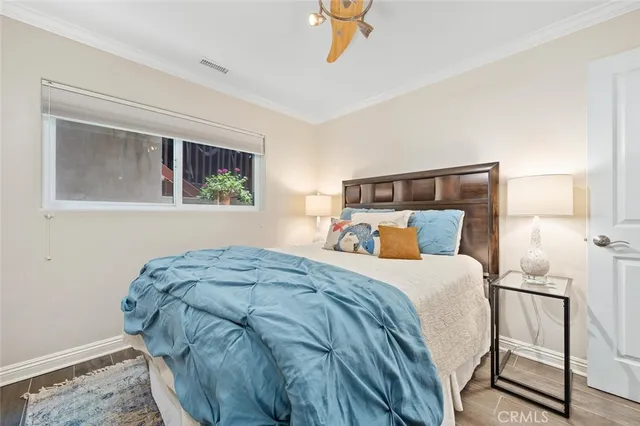 a bedroom with a bed and a dresser