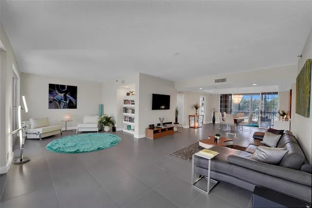 a kitchen with granite countertop white cabinets stainless steel appliances and a sink