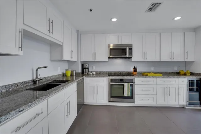 a bedroom with a bed and glass window