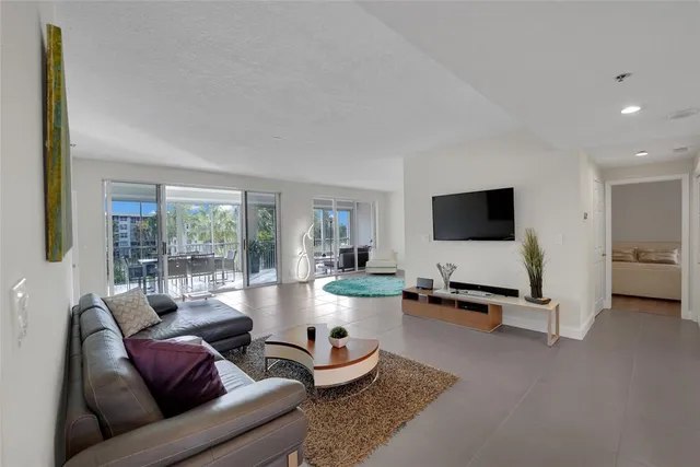 a living room with furniture and flat screen tv