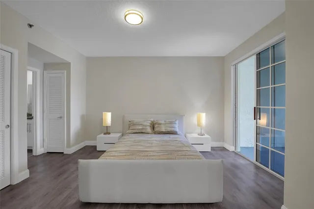 a bedroom with a bed and a mirror