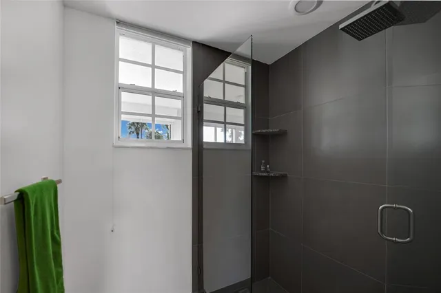 a balcony with furniture and wooden floor