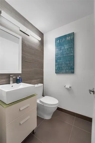 a view of a livingroom with furniture and floor to ceiling window