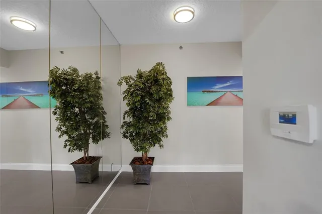 a living room with couch and a large window