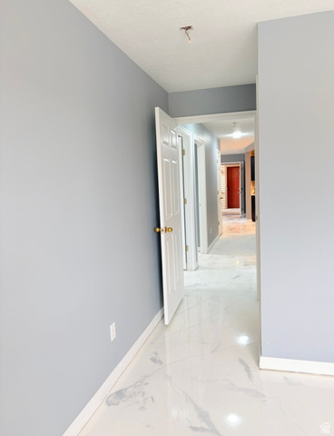 8116 North Ridge Loop West, Unit 8 Eagle Mountain, UT 84005 - Photo 8 of 23 Corridor with baseboards and light marble finish flooring