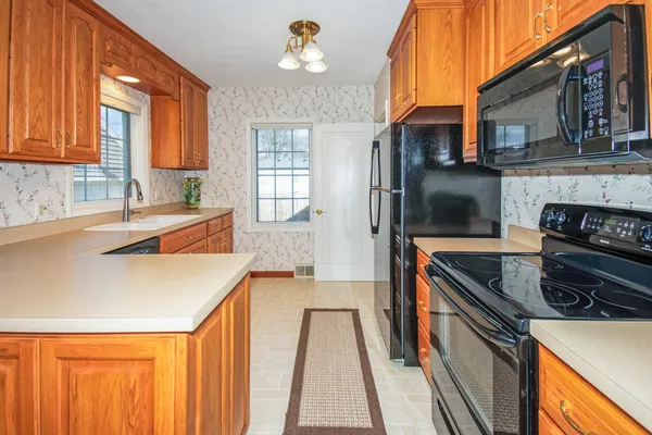 a kitchen that has a sink and a stove