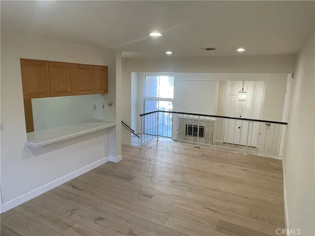 a view of a livingroom with wooden floor