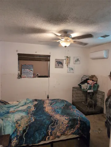 a bedroom with a bed and cabinets