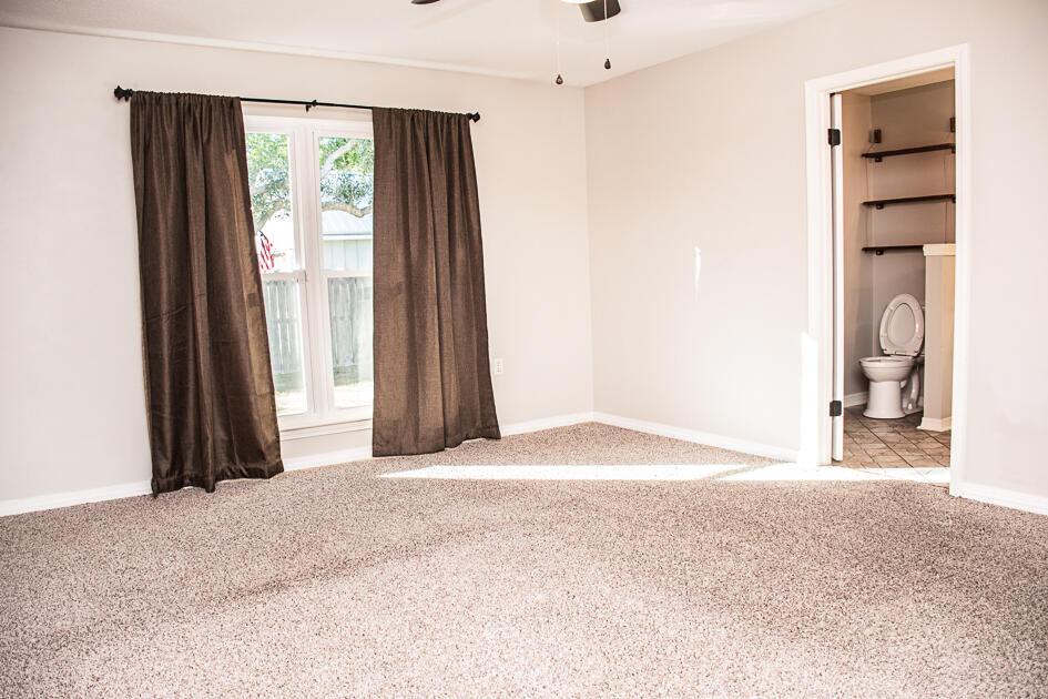 17 8th Avenue Shalimar, FL 32579 - Photo 17 of 25 a view of an empty room with a window