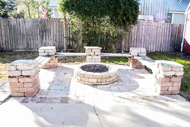 a view of a patio with a chairs and plants