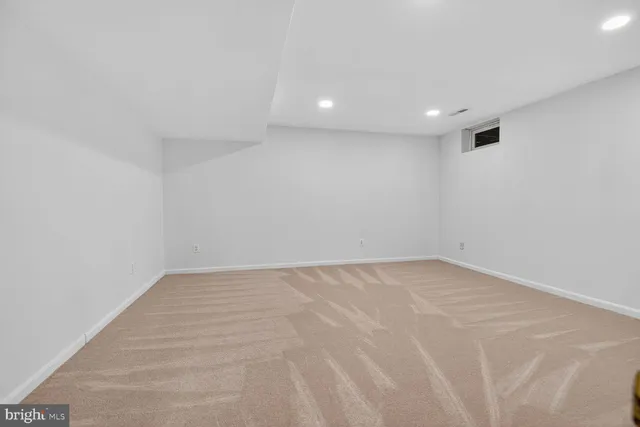 a view of a hallway with a bathroom