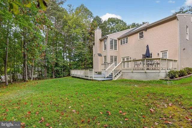 a view of balcony with wooden floor and fence