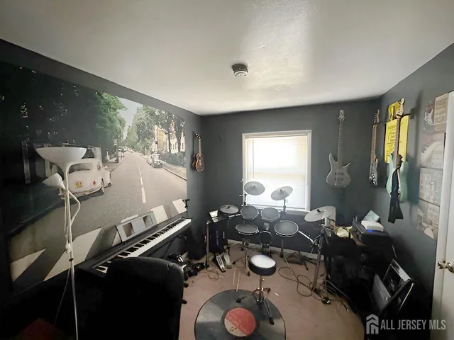 a room with gym equipment and a large window