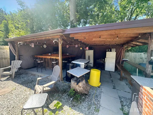 a view of a chairs and table in the patio