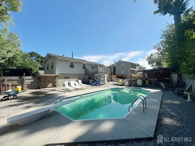 a view of a patio with couches chairs and a fire pit