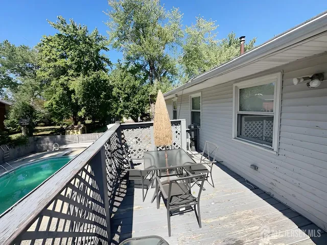 a view of balcony with furniture and garden