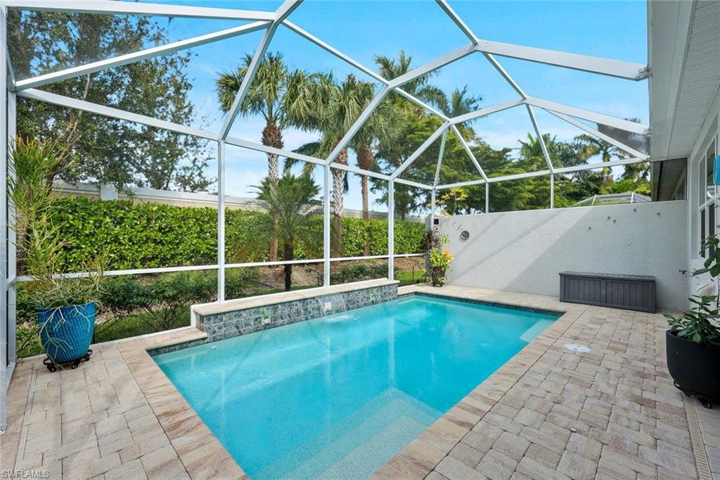 10787 Manatee Key Lane Estero, FL 33928 - Photo 19 of 31 a view of a backyard with potted plants