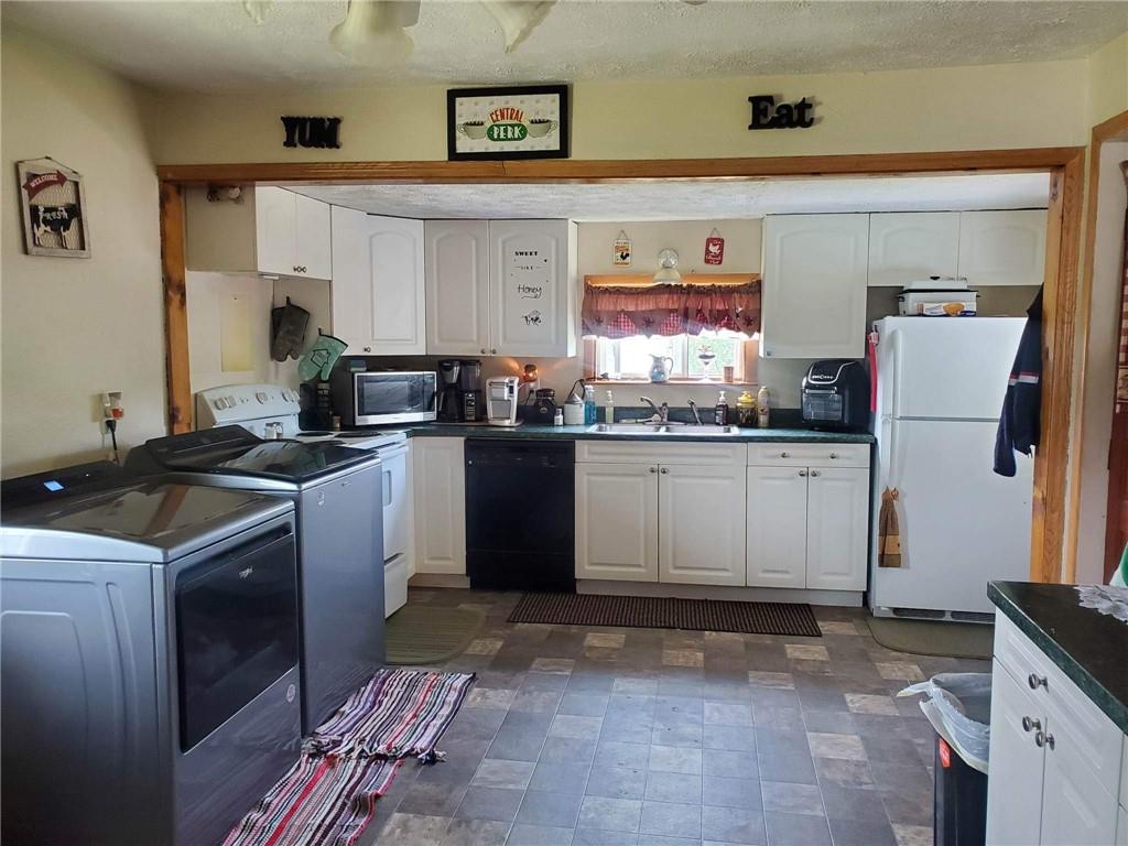 105 Febinger Alley Kittanning, PA 16201 - Photo 11 of 21 a kitchen with a sink stove and refrigerator