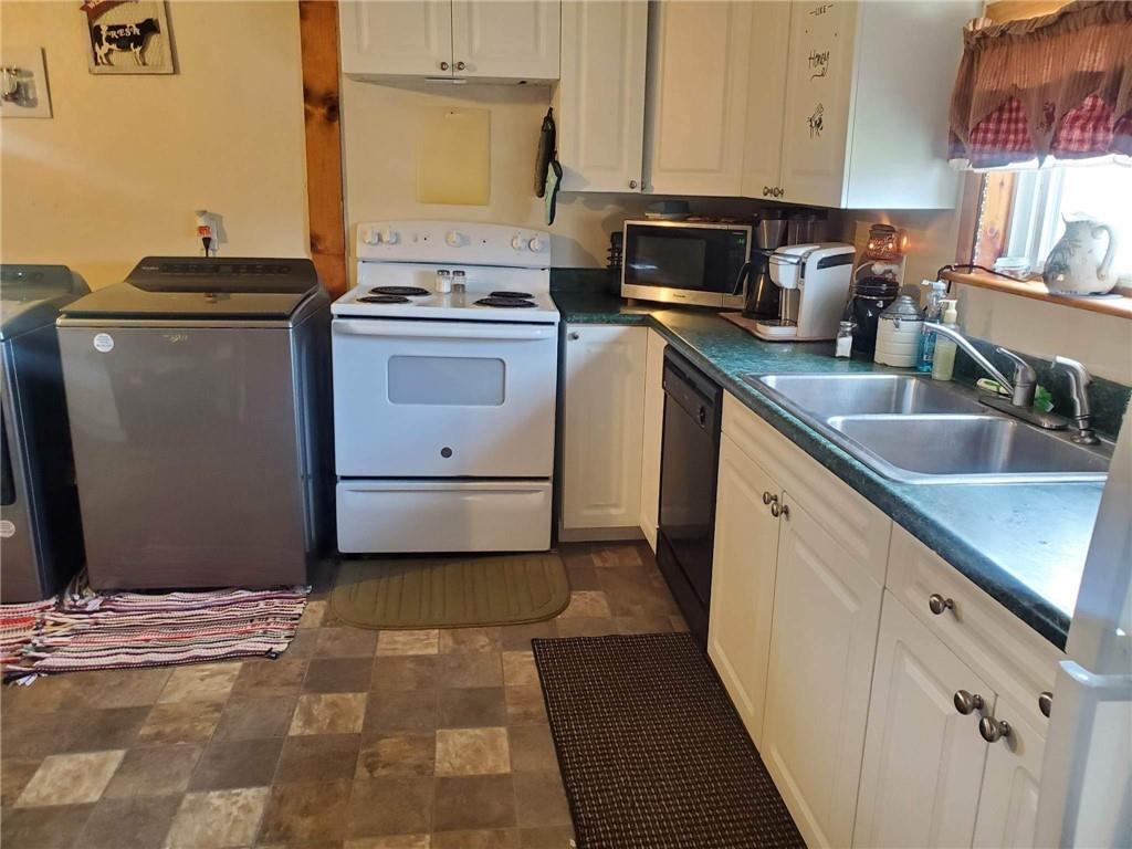 105 Febinger Alley Kittanning, PA 16201 - Photo 12 of 21 a kitchen with granite countertop a sink stove and cabinets