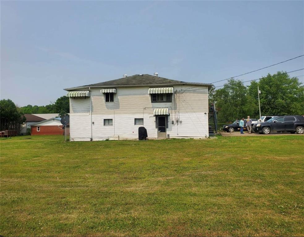 105 Febinger Alley Kittanning, PA 16201 - Photo 2 of 21 a front view of a house with a garden